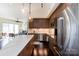 Modern kitchen with stainless steel appliances and a large island at 4620 Piedmont Row Dr # 504, Charlotte, NC 28210