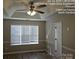 Well-lit bedroom with ceiling fan and neutral decor at 4630 Sw Falcon Chase Sw Dr, Concord, NC 28027