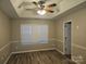 Bright bedroom with wood-look floors and window coverings at 4630 Sw Falcon Chase Sw Dr, Concord, NC 28027