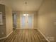 Dining area with wood-look floors and double doors at 4630 Sw Falcon Chase Sw Dr, Concord, NC 28027