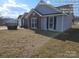 Side view of charming ranch home with well-manicured lawn at 4630 Sw Falcon Chase Sw Dr, Concord, NC 28027