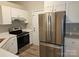 Kitchen with stainless steel appliances and white cabinets at 4630 Sw Falcon Chase Sw Dr, Concord, NC 28027