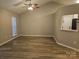 Spacious living room with wood-look floors and high ceiling at 4630 Sw Falcon Chase Sw Dr, Concord, NC 28027