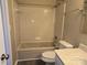 Full bathroom with bathtub, toilet, and vanity at 4902 Spring Lake Dr # E, Charlotte, NC 28212