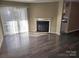 Living room with fireplace and hardwood floors at 4902 Spring Lake Dr # E, Charlotte, NC 28212