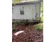 Slightly unkempt backyard with debris and a chicken coop at 517 Ashford St, Chester, SC 29706