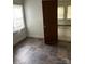 Simple dining room with tiled floor and door to another room at 517 Ashford St, Chester, SC 29706