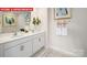 Double vanity bathroom with hexagon tile floor and large mirror at 553 Zermatt Ct, Monroe, NC 28112