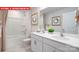 Bathroom with double vanity, shower, and white tile floor at 553 Zermatt Ct, Monroe, NC 28112