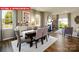 Elegant dining room with hardwood floors and adjacent living space at 553 Zermatt Ct, Monroe, NC 28112