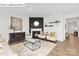 Living room featuring a fireplace and built-in shelving at 560 Zermatt St, Monroe, NC 28112