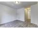 Spacious bedroom with gray carpet and neutral walls at 6411 Windsor Gate Ln, Charlotte, NC 28215