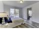 Spacious bedroom with gray carpet and access to another room at 6411 Windsor Gate Ln, Charlotte, NC 28215