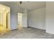 Spacious bedroom with gray carpet and access to another room at 6411 Windsor Gate Ln, Charlotte, NC 28215