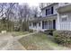 Townhome exterior showcasing a front porch and landscaping at 6411 Windsor Gate Ln, Charlotte, NC 28215