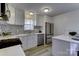 Bright kitchen boasts stainless steel appliances and an island at 6411 Windsor Gate Ln, Charlotte, NC 28215