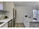 Updated kitchen featuring stainless steel appliances and white cabinetry at 6411 Windsor Gate Ln, Charlotte, NC 28215