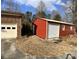 A detached red shed with a roll up garage door at 740 Jackson Rd, Salisbury, NC 28146