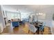 Open concept dining area with hardwood floors and a view of the living room and kitchen at 8012 Plymouth Dr, Sherrills Ford, NC 28673