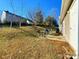 Small backyard patio with table and chairs, offering an outdoor space for relaxing and grilling at 8024 Bronze Pike Dr, Charlotte, NC 28273