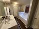 Bathroom boasts a bathtub, shower, and double vanity at 8024 Bronze Pike Dr, Charlotte, NC 28273