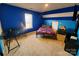 Bright bedroom with a full bed and built-in desk at 8024 Bronze Pike Dr, Charlotte, NC 28273