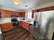 Kitchen with stainless steel appliances and wood cabinets at 8024 Bronze Pike Dr, Charlotte, NC 28273