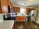 Kitchen with stainless steel appliances and wood cabinets at 8024 Bronze Pike Dr, Charlotte, NC 28273