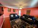 Living room with hardwood floors and orange walls at 8024 Bronze Pike Dr, Charlotte, NC 28273