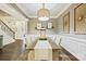 Dining room with a rustic wooden table and a stylish chandelier at 8130 Clems Branch Rd, Fort Mill, SC 29707