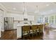 Island kitchen with white shaker cabinets, quartz countertops, and stainless steel appliances at 8130 Clems Branch Rd, Fort Mill, SC 29707