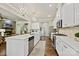 Gourmet kitchen featuring white cabinets, quartz countertops and a large island at 8130 Clems Branch Rd, Fort Mill, SC 29707