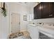 Convenient laundry room with washer, dryer, and ample cabinet storage at 8130 Clems Branch Rd, Fort Mill, SC 29707