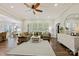 Bright and airy living room featuring a large sectional sofa and hardwood floors at 8130 Clems Branch Rd, Fort Mill, SC 29707