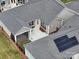 Aerial view of the home's roof, screened in porch, patio, and backyard at 9029 Treetop Nw Way, Concord, NC 28027