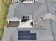 Aerial view of the home's roof, screened in porch, patio, and landscaped backyard at 9029 Treetop Nw Way, Concord, NC 28027