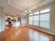 Hardwood flooring in dining room, with large windows bringing in natural light at 9029 Treetop Nw Way, Concord, NC 28027