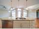 Spacious kitchen island featuring a stainless steel sink and a large granite countertop at 9029 Treetop Nw Way, Concord, NC 28027