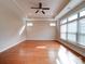 Bright living room features gleaming hardwood floors, recessed lighting, and lots of natural light at 9029 Treetop Nw Way, Concord, NC 28027