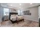 Main bedroom with large bed, gray headboard and wood floors at 9842 Quercus Ln, Huntersville, NC 28078