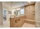 A stylish bathroom featuring a double sink vanity, a large mirror, and a walk in shower at 9934 Cask Way, Huntersville, NC 28078