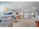 Finished Bonus Room featuring large sectional sofa and staircase at 9934 Cask Way, Huntersville, NC 28078