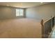 Unfinished bonus room with natural light from a window at 9934 Cask Way, Huntersville, NC 28078