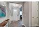 Entryway featuring neutral walls and trim, a chandelier, and a console table showcasing the welcoming space at 9934 Cask Way, Huntersville, NC 28078