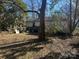 Backyard with deck and mature trees at 1004 Druid Cir, Charlotte, NC 28206