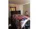 Bedroom with a floral bedspread and wooden headboard at 1004 Druid Cir, Charlotte, NC 28206