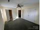 Bright bedroom with double-door closet and ceiling fan at 1004 Johnson St, Charlotte, NC 28206