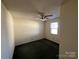 Simple bedroom with ceiling fan and carpet at 1004 Johnson St, Charlotte, NC 28206