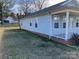 Side view showcasing the light blue siding and a neatly kept lawn at 1004 Johnson St, Charlotte, NC 28206