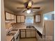 Kitchen with white cabinets, a gas stove and double sink at 1004 Johnson St, Charlotte, NC 28206